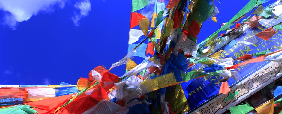 Colourful prayer flags flutter in the wind