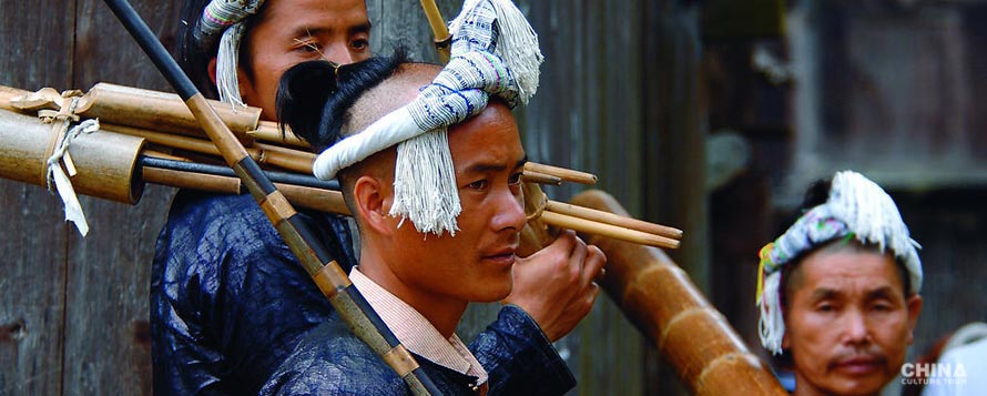 Miao ethnic people with Lu Sheng, a Chinese wind instrument